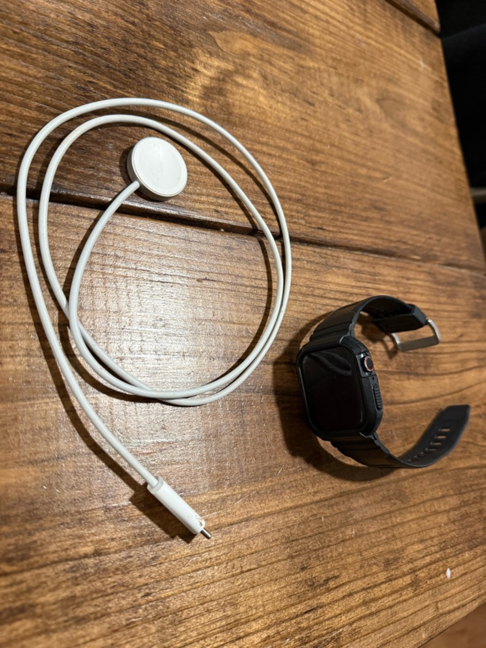 Apple Smartwatch Black with White Charger Cable